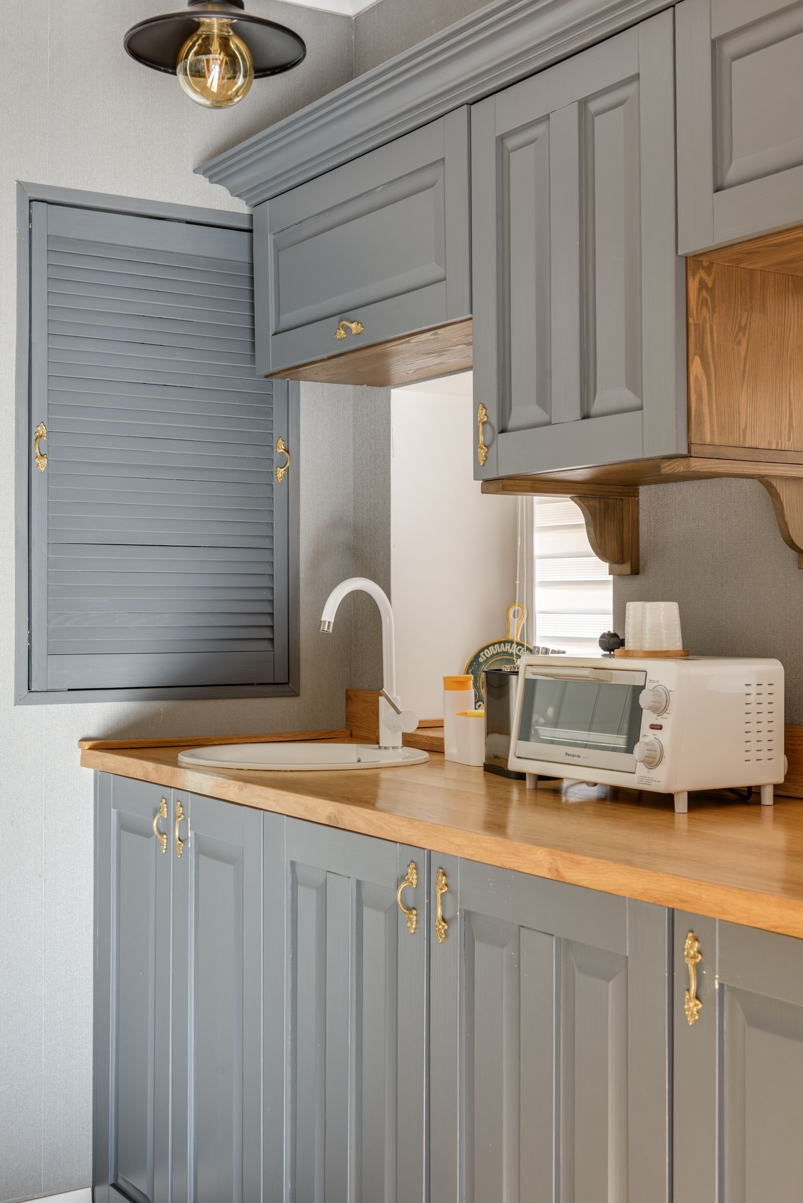 Grey painted kitchen cabinets
