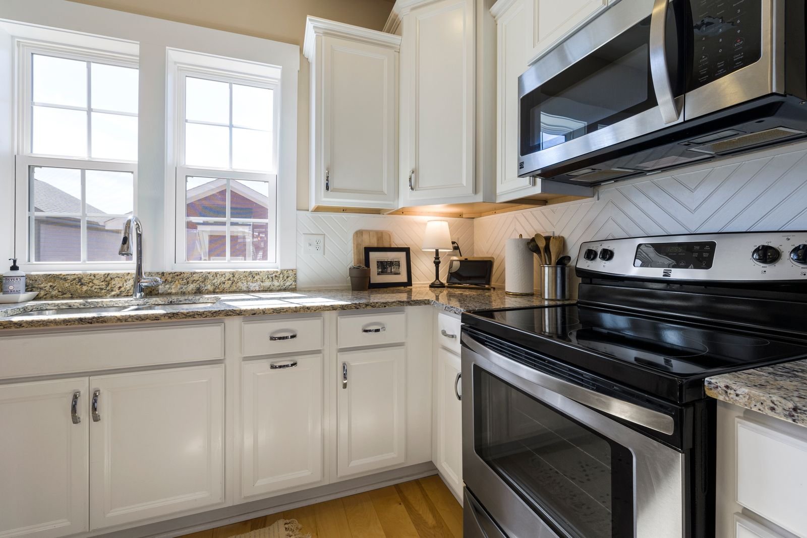 Kitchen with freshly painted white cabinets