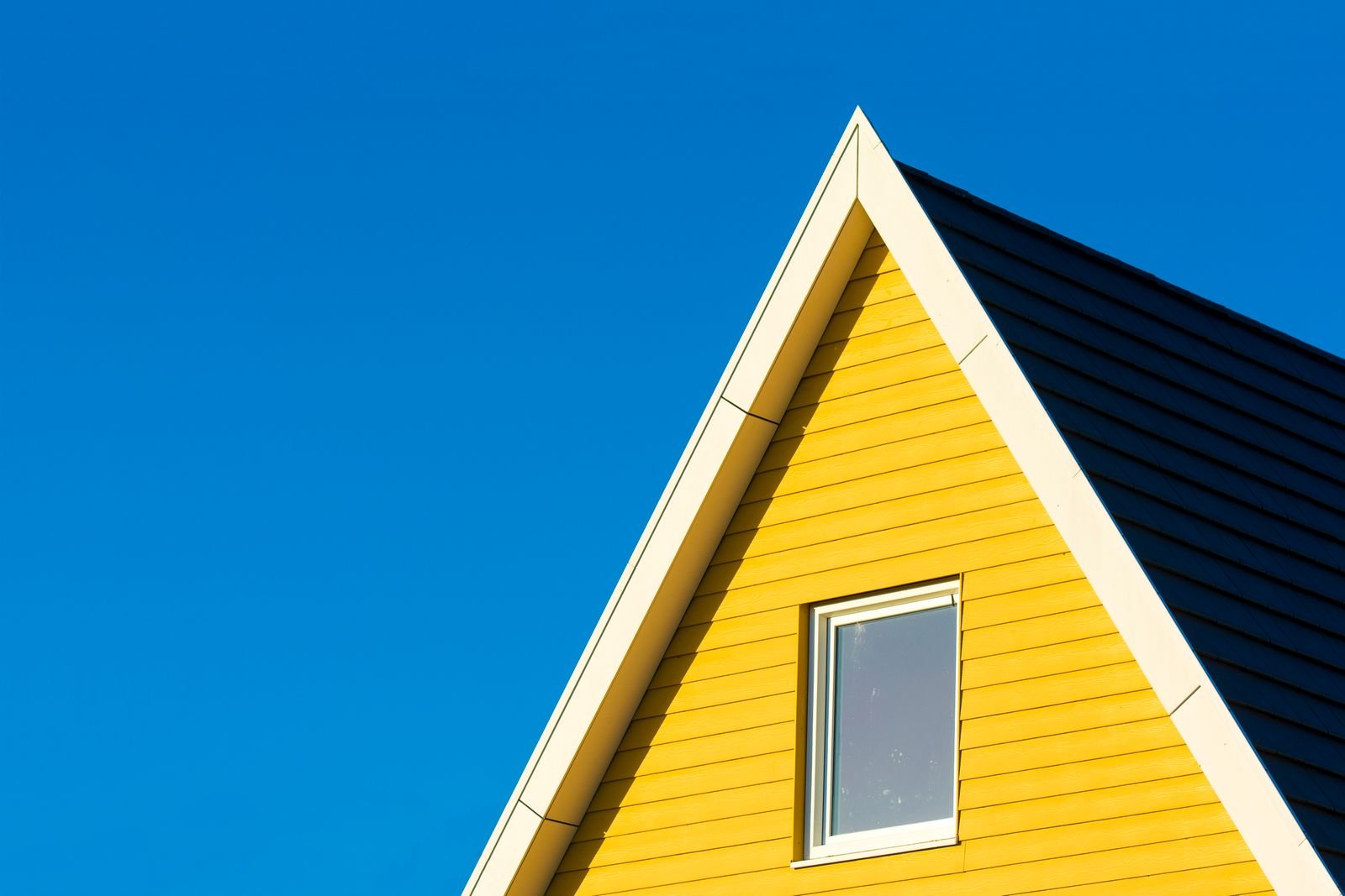 Yellow painted gable and white trim